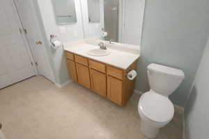 Full bath featuring vanity and toilet