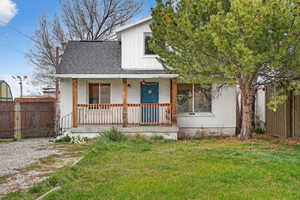 Bungalow-style home featuring a porch, roof with shingles, and stucco siding