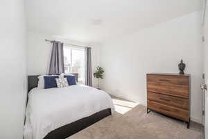 Carpeted bedroom with baseboards