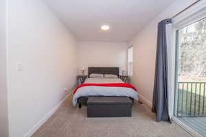 Carpeted bedroom with baseboards