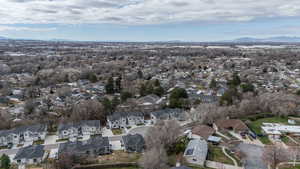 Aerial perspective of suburban area featuring a mountainous background