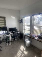 Home office featuring light carpet