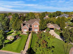 Aerial view of residential area featuring a tree filled landscape
