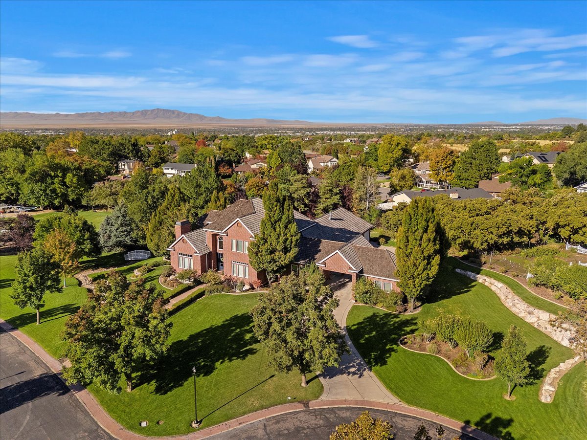 Aerial perspective of suburban area with a mountainous background