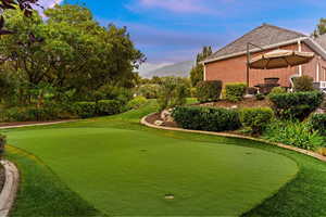 View of property's community with a putting area and a mountain view