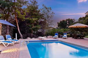 Outdoor pool with a patio area