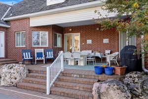 Deck with a grill and outdoor dining area