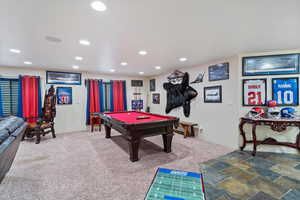 Recreation room with pool table, carpet floors, recessed lighting, and stone finish flooring