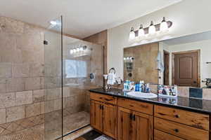 Full bath featuring vanity and walk in shower