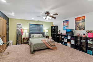 Bedroom with carpet flooring, a ceiling fan, a closet, and recessed lighting