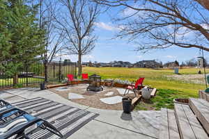 View of patio / terrace featuring a residential view and an outdoor fire pit