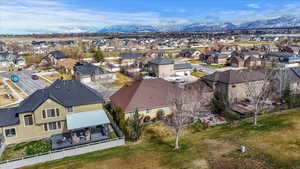 Aerial view of residential area featuring a mountain backdrop