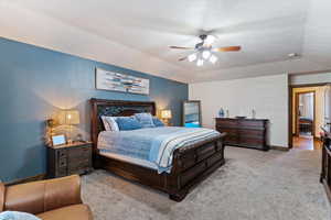 Bedroom featuring light colored carpet and a ceiling fan