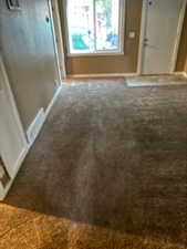 Interior space with carpet floors and baseboards