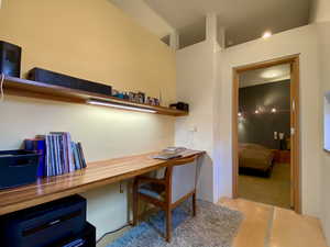 Home office featuring built in desk