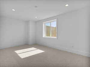 Unfurnished room featuring carpet and recessed lighting