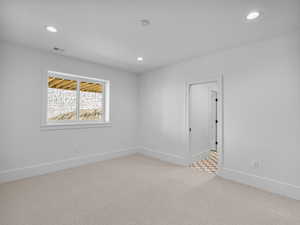 Unfurnished room featuring light carpet and recessed lighting