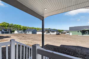 View of yard featuring a residential view and a porch