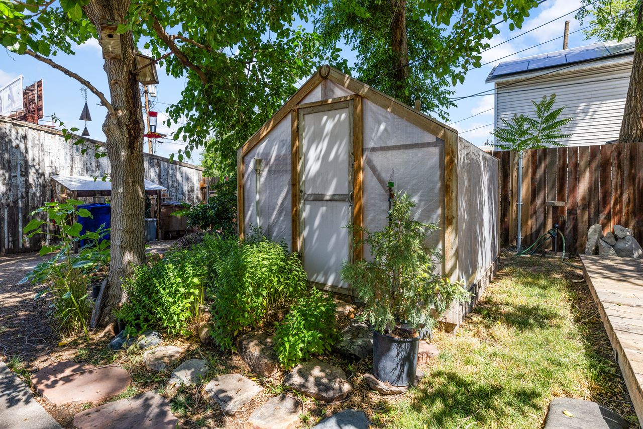 View of shed with a fenced backyard
