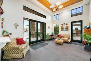 Lobby featuring a high tray ceiling