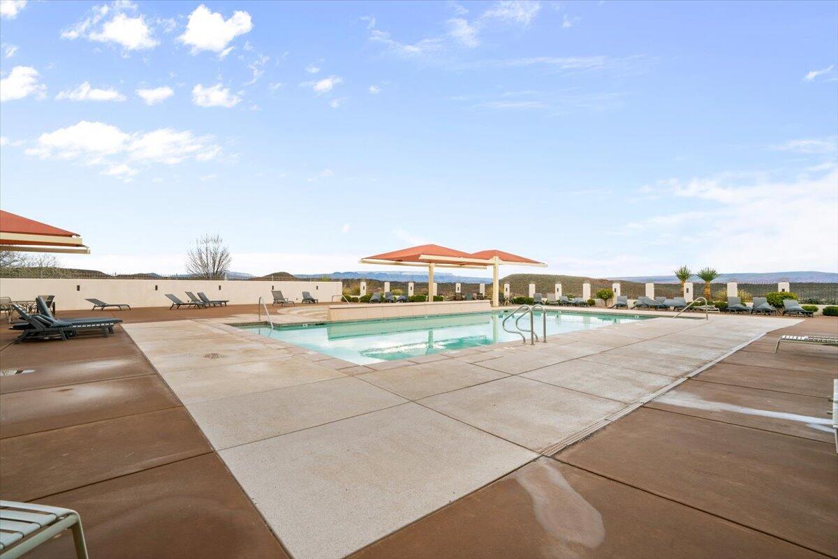 Community pool featuring a patio