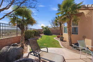 Fenced backyard featuring a patio