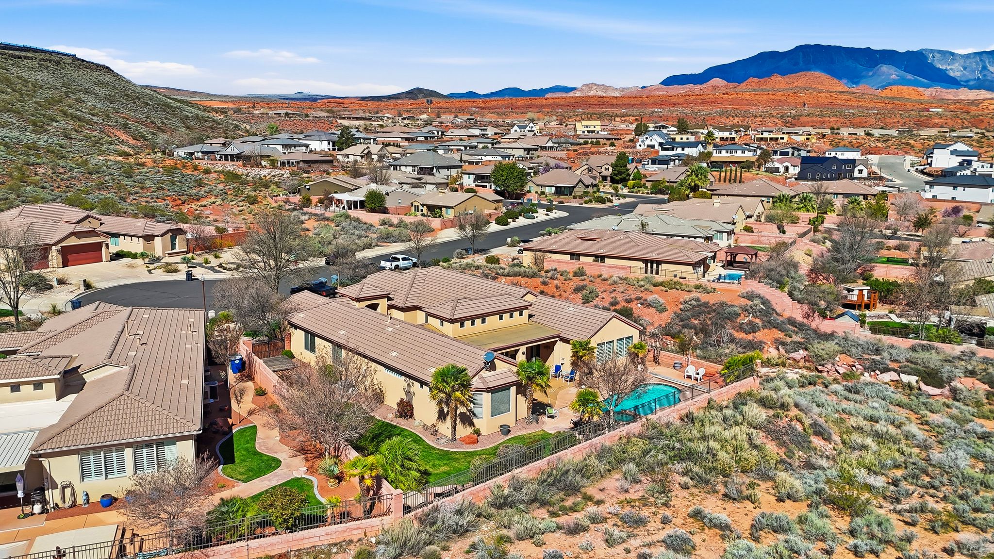 Aerial view of residential area with a mountainous background