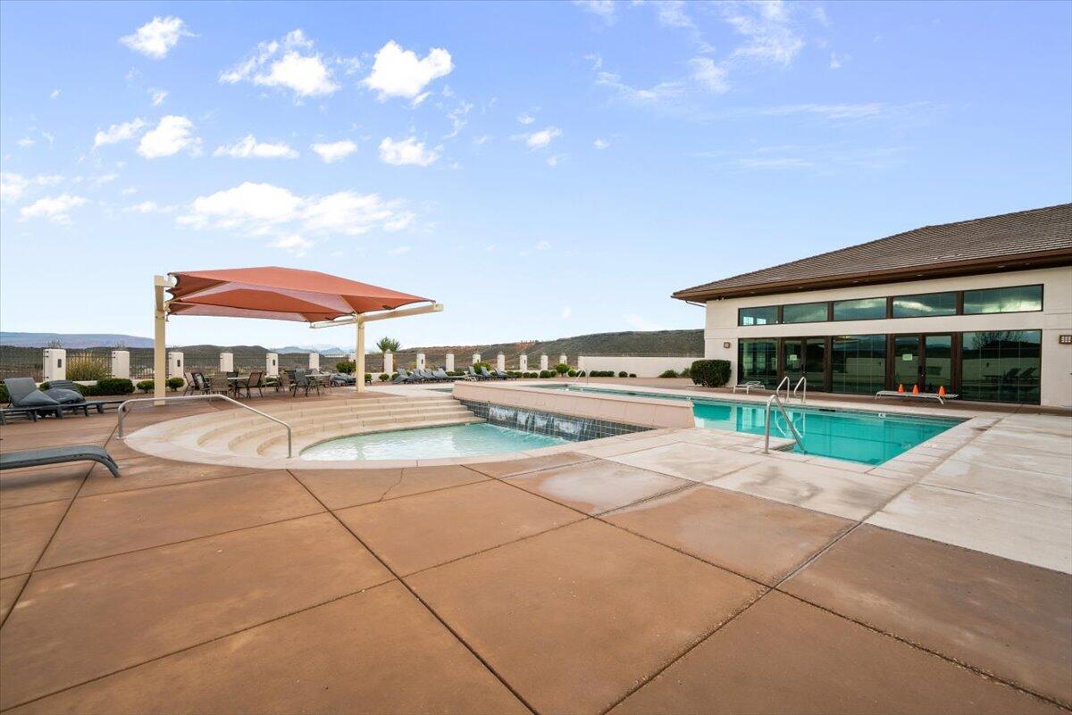 Community pool featuring a patio