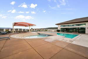 Community pool featuring a patio