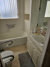 Bathroom featuring vanity and a bathtub