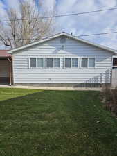 View of home's exterior with a lawn