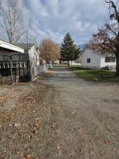 View of dirt / gravel road featuring a residential view