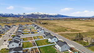 Aerial perspective of suburban area featuring a mountainous background