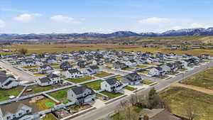 Aerial perspective of suburban area featuring a mountain backdrop