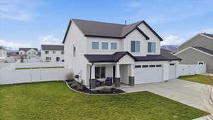 Modern inspired farmhouse with roof with shingles, a gate, board and batten siding, and a fenced backyard