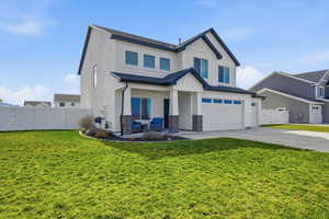 Craftsman inspired home with an attached garage, a gate, driveway, board and batten siding, and a porch