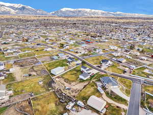 Aerial view of residential area featuring a mountainous background