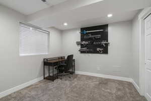 Office space with carpet and recessed lighting