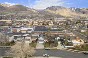 Aerial perspective of suburban area featuring a mountain backdrop