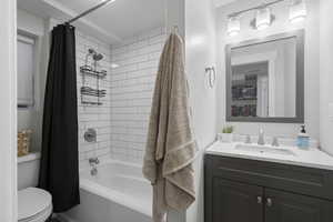 Bathroom with vanity and shower / tub combo