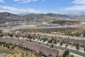 Aerial perspective of suburban area featuring a mountainous background