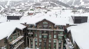 Snowy aerial view with a mountain view