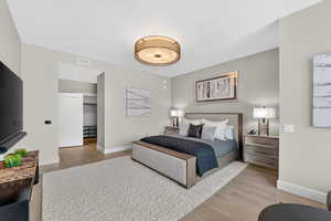 Bedroom featuring baseboards and light wood-style flooring
