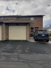 View of front of property featuring brick siding