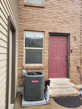 Entrance to property with brick siding