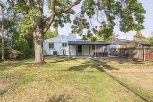 Rear view of property featuring a patio area