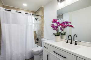 Full bathroom featuring vanity and shower / tub combo