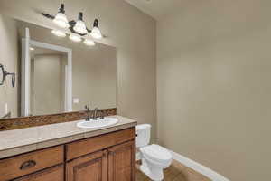 Bathroom featuring vanity and light tile patterned floors