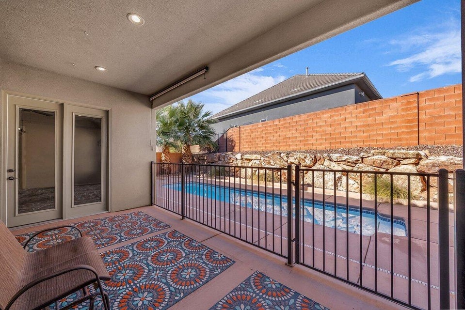 Patio / terrace featuring a fenced backyard, a patio area, and a hot tub