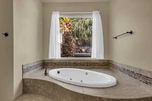 Bathroom with a jetted tub
